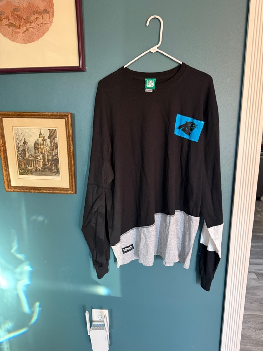 NFL Black Long Sleeve Tee with Carolina Panthers Logo and Gray Hem